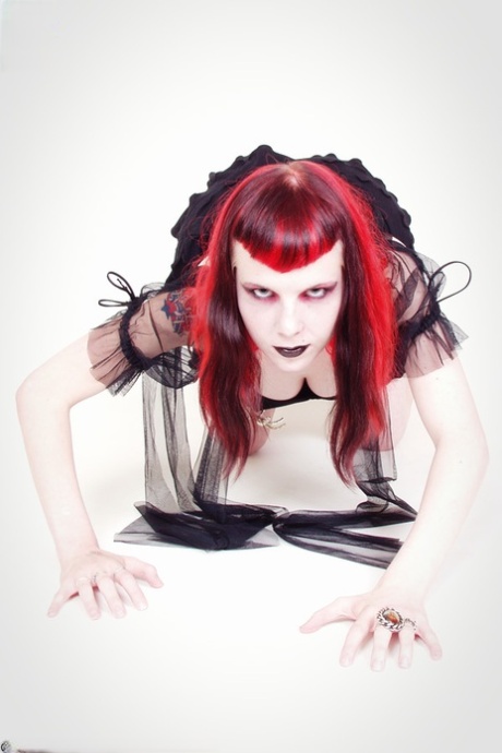 Goth girl licks her lips while showing her firm tits and vagina 21870373